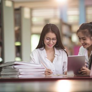 young-students-learning-library-bookshelves